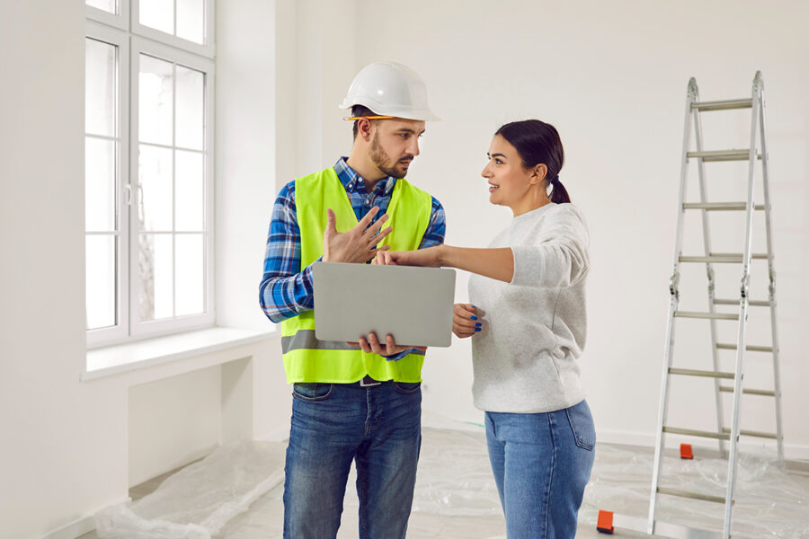 Home contractor discussing plans with home owner